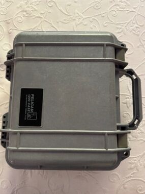 Pelican Protector 1200 Case , gray, under 5 lbs light, durable, good condition.